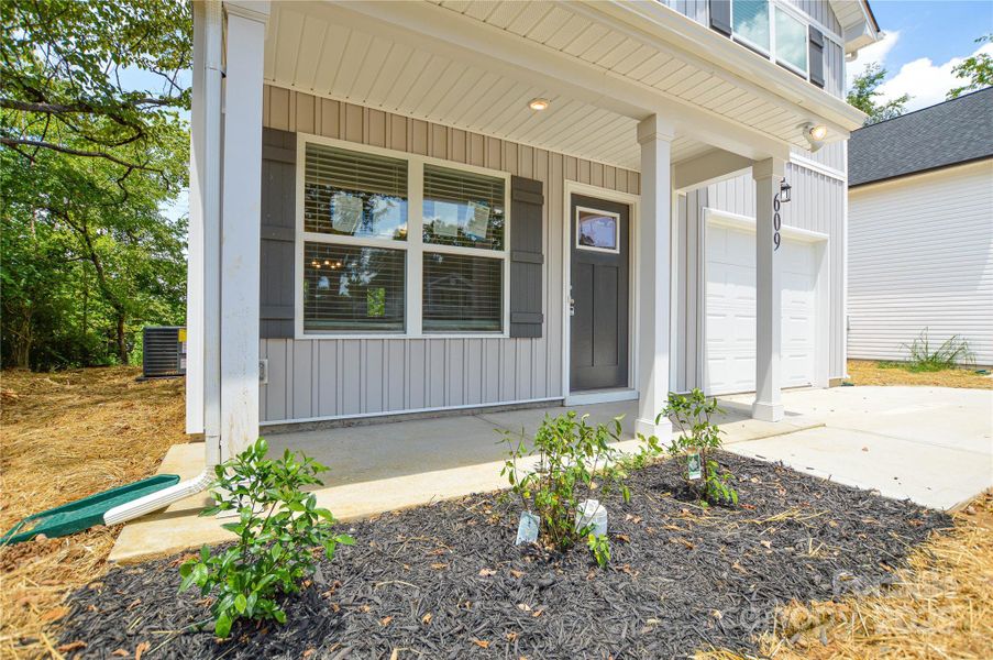 Front exterior of a new home in , Mount Holly, NC, highlighting curb appeal (Image 2). Front exterior of a new home in , Mount Holly, NC, highlighting curb appeal (Image 2).