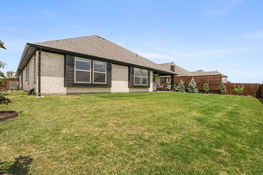 Exterior details and patio area of a home in Hayes Crossing, Midlothian (Image 22).