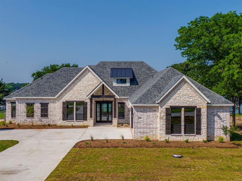 Front exterior of a new home in , Ennis, TX, highlighting curb appeal (Image 19).