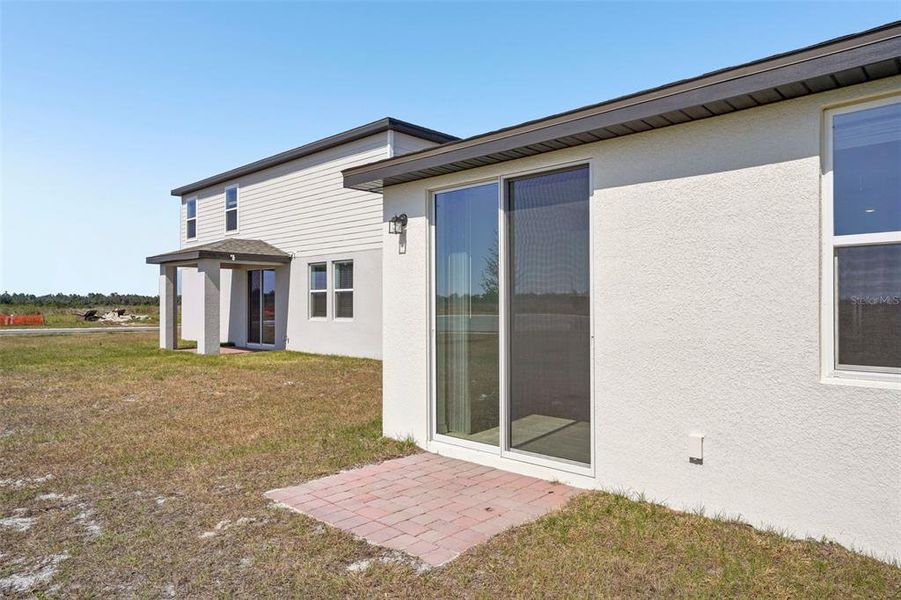 Exterior details and patio area of a home in Lake Deer Estates - Signature Series, Poinciana (Image 27). Exterior details and patio area of a home in Lake Deer Estates - Signature Series, Poinciana (Image 27).