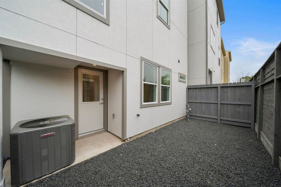 The perfect size backyard space is the perfect size to let the dogs out,  for a grill and a small table and chairs.