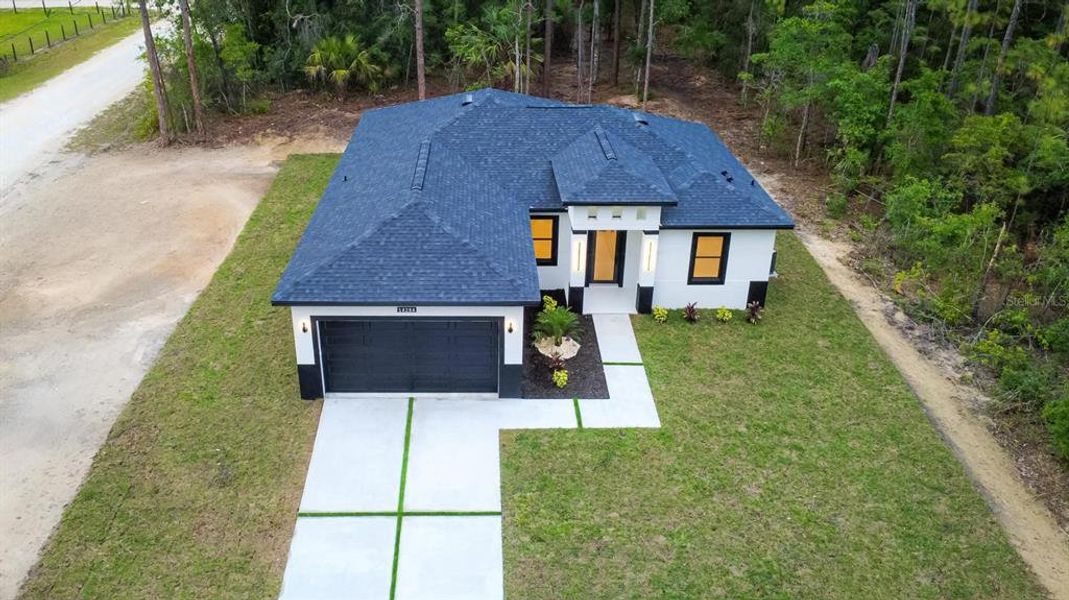 Front exterior of a new home in , Brooksville, FL, highlighting curb appeal (Image 20).