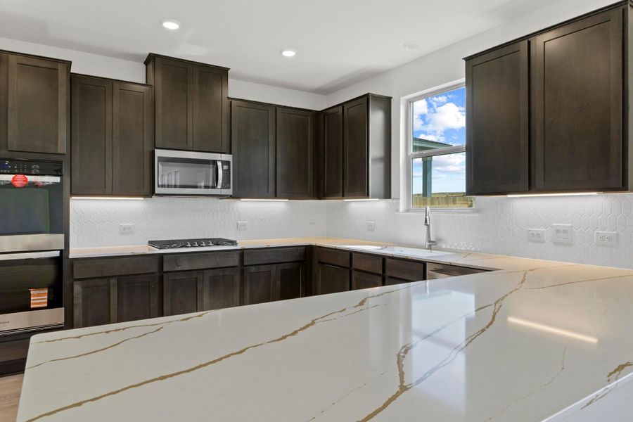 Furnished interior view inside a new home in Salerno - Classic Collection, Round Rock (Image 8). Furnished interior view inside a new home in Salerno - Classic Collection, Round Rock (Image 8).