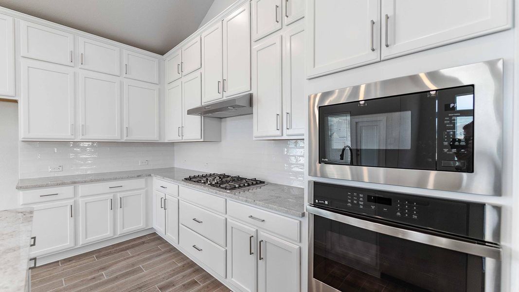 Furnished interior view inside a new home in Sunterra, Katy (Image 3).