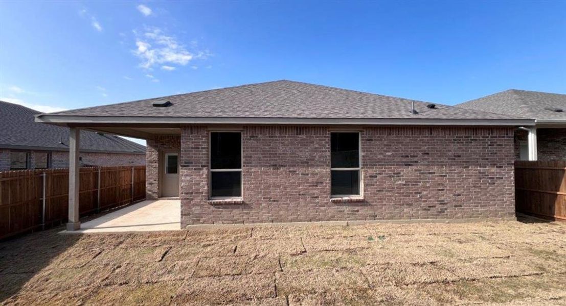 Exterior details and patio area of a home in Bluestem, Rhome (Image 2). Exterior details and patio area of a home in Bluestem, Rhome (Image 2).
