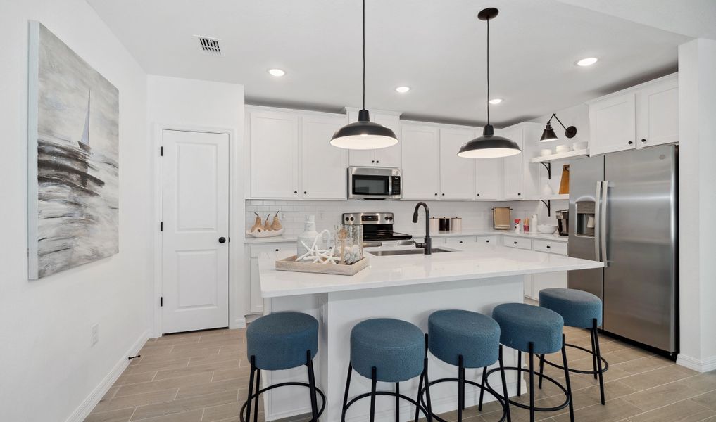 Palatial kitchen with floating shelves & matte black hardware