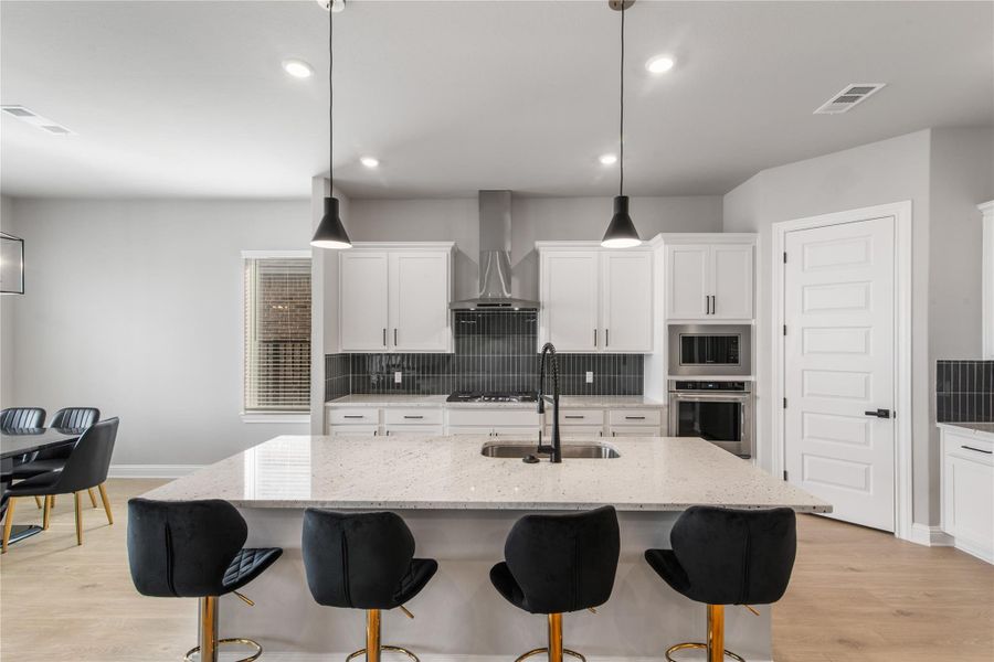 Experience the inviting bar area with ample seating, perfect for entertaining and relaxation.