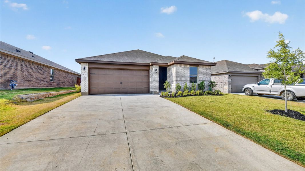 Front exterior of a new home in Legado, Cleburne, TX, highlighting curb appeal (Image 23).