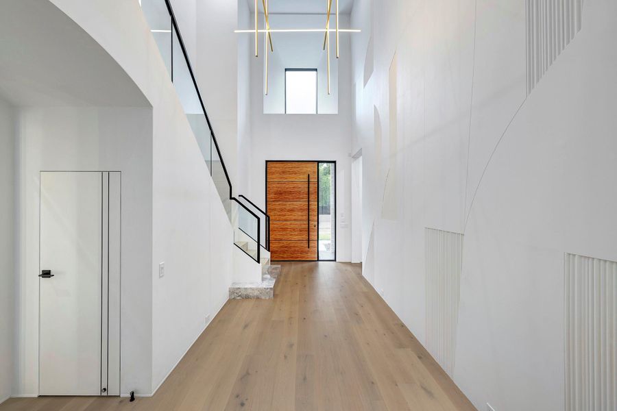 A modern, spacious foyer with high ceilings and sleek design.