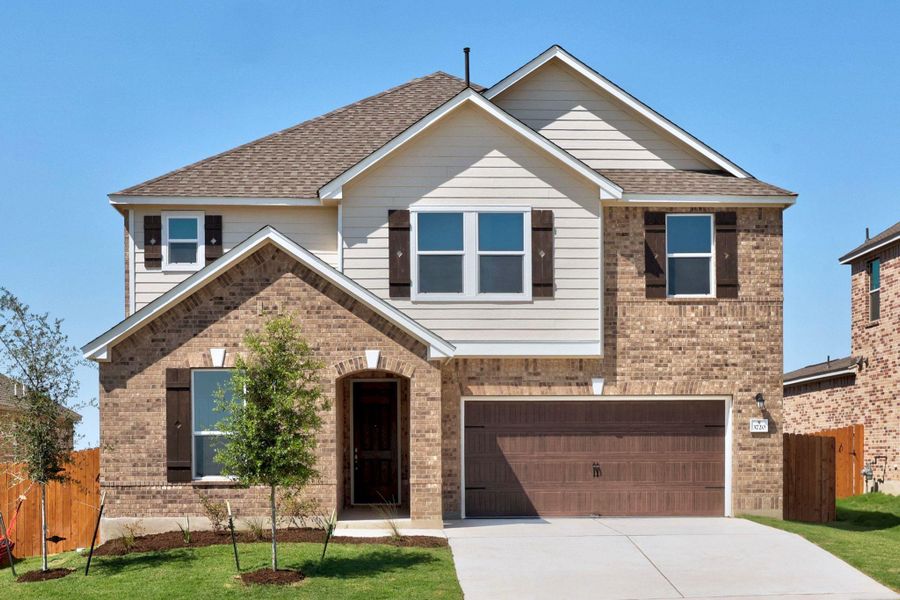 Front exterior of a new home in Salerno - Classic Collection, Round Rock, TX, highlighting curb appeal (Image 18). Front exterior of a new home in Salerno - Classic Collection, Round Rock, TX, highlighting curb appeal (Image 18).