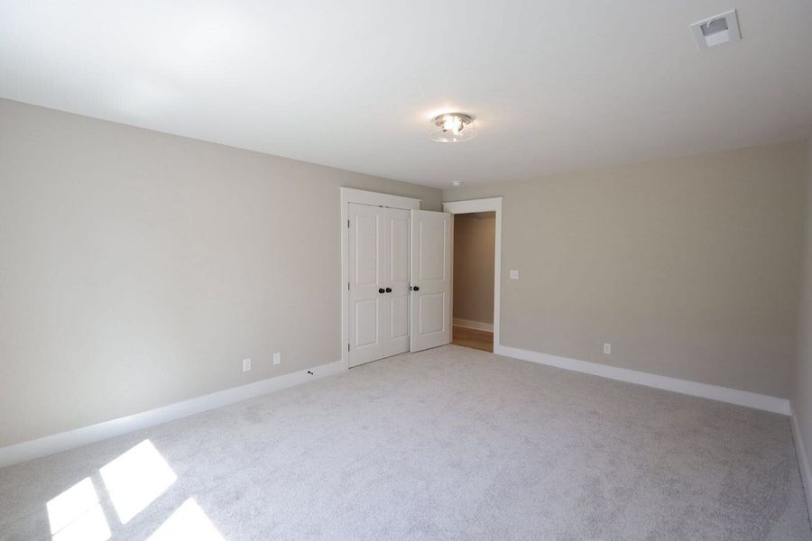 Spacious, unfurnished interior of a new home in Baker Road, Birchwood (Image 53).