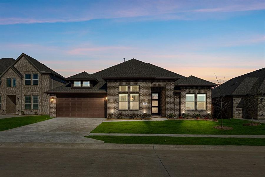 Front exterior of a new home in Timberbrook, Justin, TX, highlighting curb appeal (Image 2).