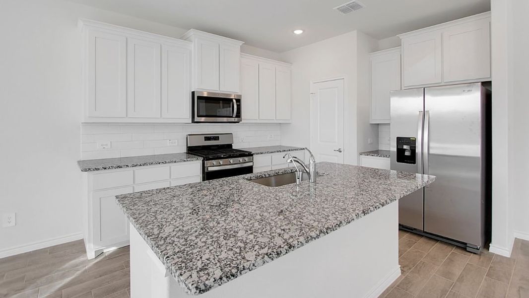 Furnished interior view inside a new home in Prairie Oaks, Oak Point (Image 5).