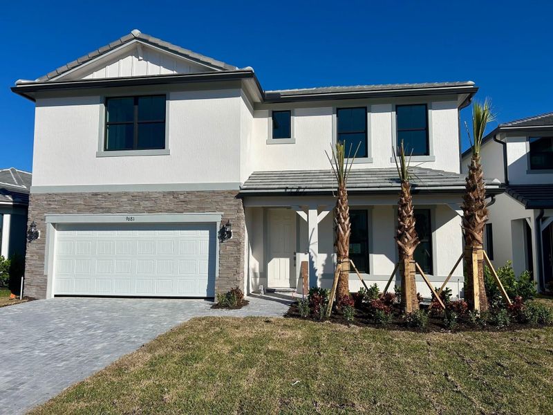 Front exterior of a new home in Hendrix Reserve, Lake Worth, FL, highlighting curb appeal (Image 1).