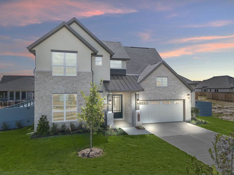 Front exterior of a new home in Fulshear Lakes, Fulshear, TX, highlighting curb appeal (Image 29). Front exterior of a new home in Fulshear Lakes, Fulshear, TX, highlighting curb appeal (Image 29).