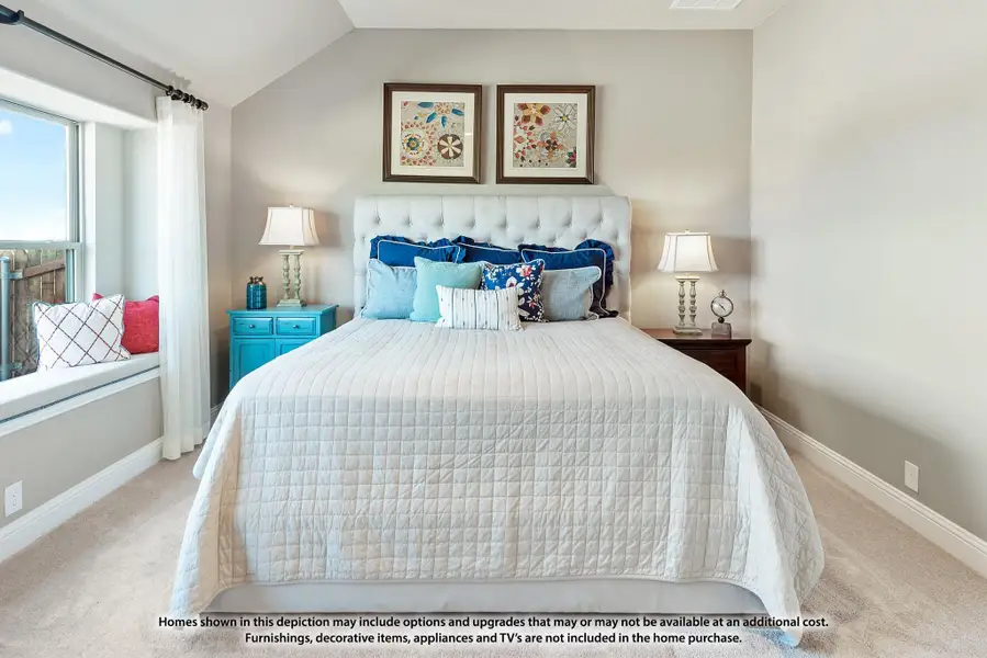 Bedroom with tufted white headboard, carpet flooring, window seat, and two framed artworks above the bed Bedroom with tufted white headboard, carpet flooring, window seat, and two framed artworks above the bed