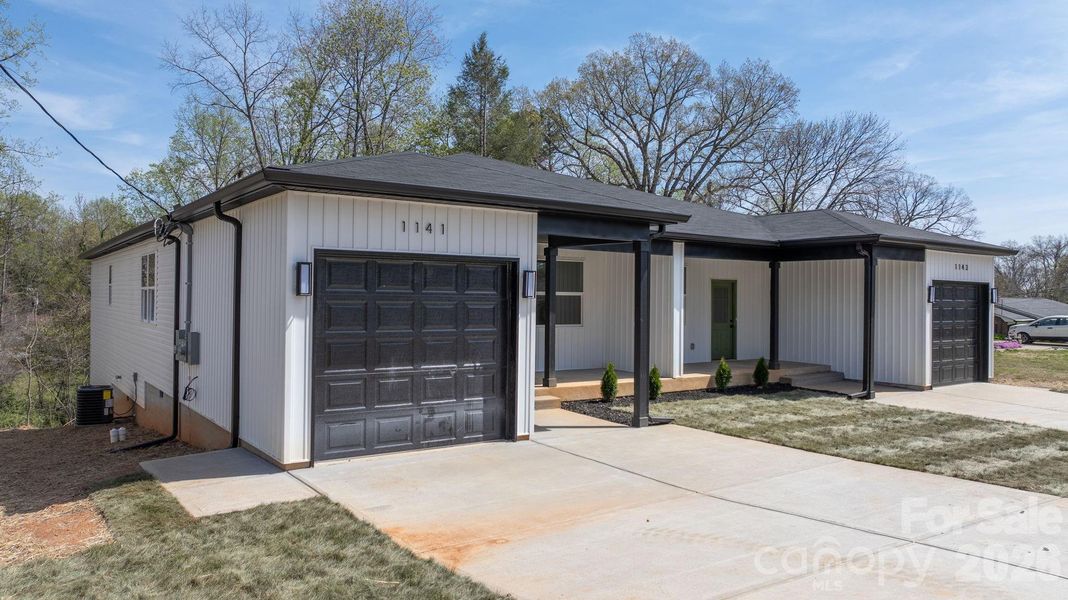 Front exterior of a new home in , Hickory, NC, highlighting curb appeal (Image 22).