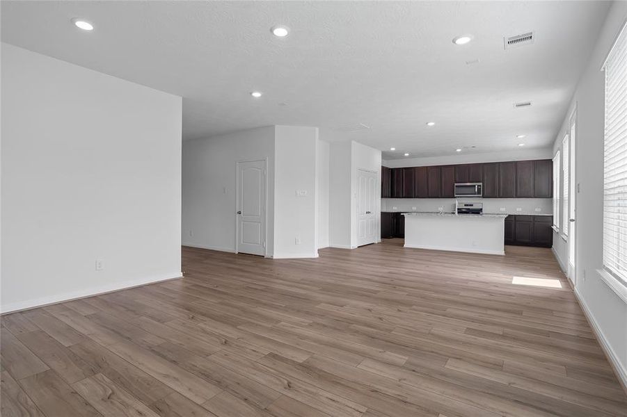 Another gorgeous view of the great room looking into the kitchen and dining area.