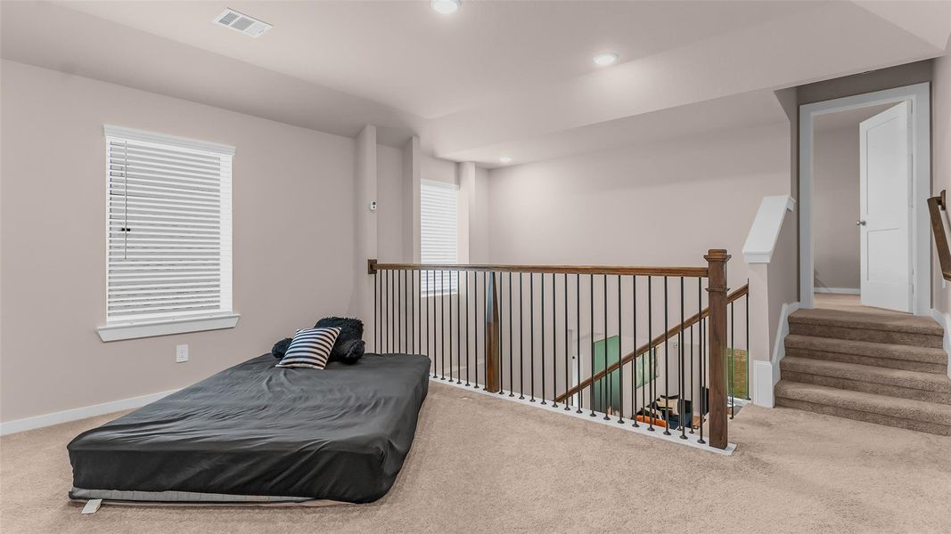 Up the stairs to the large 2nd living space or gameroom. Up the few additional stairs is the 5th bedroom with full en-suite bath and walk in closet