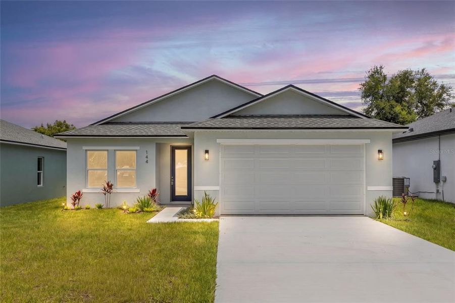 Front exterior of a new home in , Osteen, FL, highlighting curb appeal (Image 2). Front exterior of a new home in , Osteen, FL, highlighting curb appeal (Image 2).