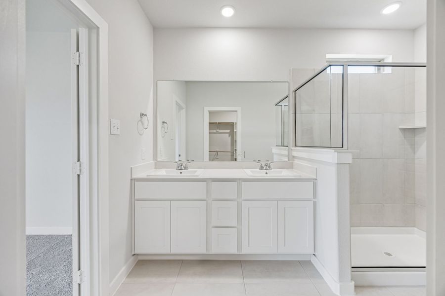 Primary Bathroom in the Stanley II home plan by Trophy Signature Homes – REPRESENTATIVE PHOTO