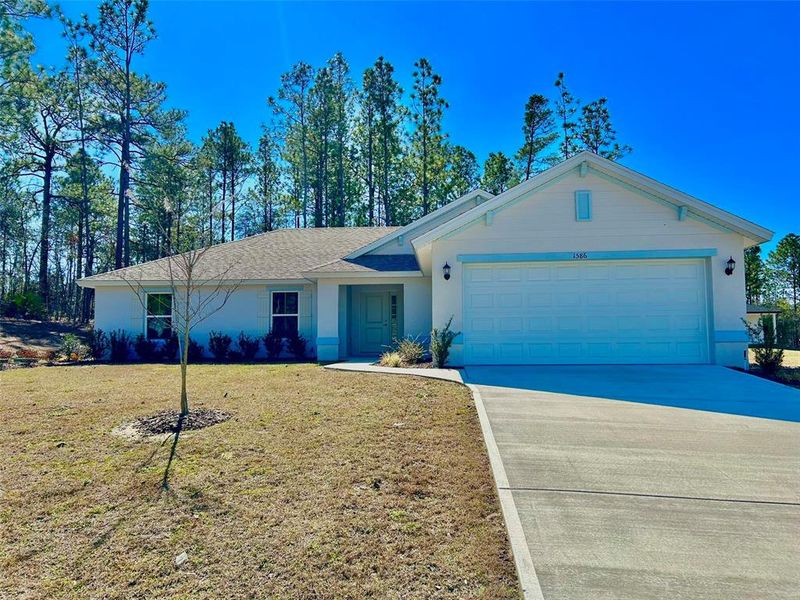 Front exterior of a new home in , Citrus Springs, FL, highlighting curb appeal (Image 1). Front exterior of a new home in , Citrus Springs, FL, highlighting curb appeal (Image 1).