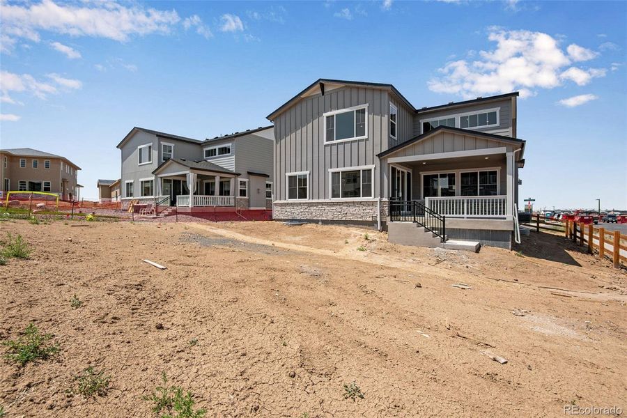 Front exterior of a new home in Ensemble at The Aurora Highlands, Aurora, CO, highlighting curb appeal (Image 2).