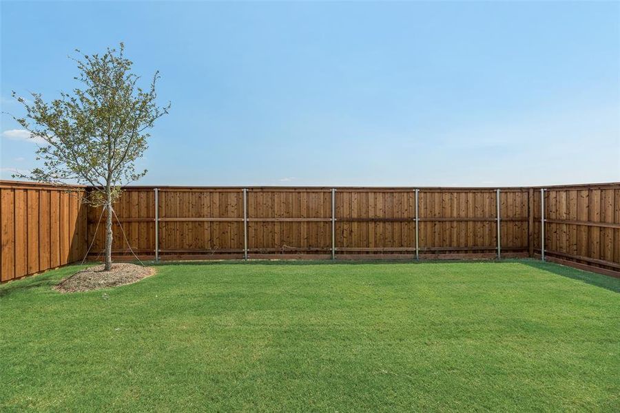 Front exterior of a new home in Spiritas Ranch, Little Elm, TX, highlighting curb appeal (Image 20). Front exterior of a new home in Spiritas Ranch, Little Elm, TX, highlighting curb appeal (Image 20).