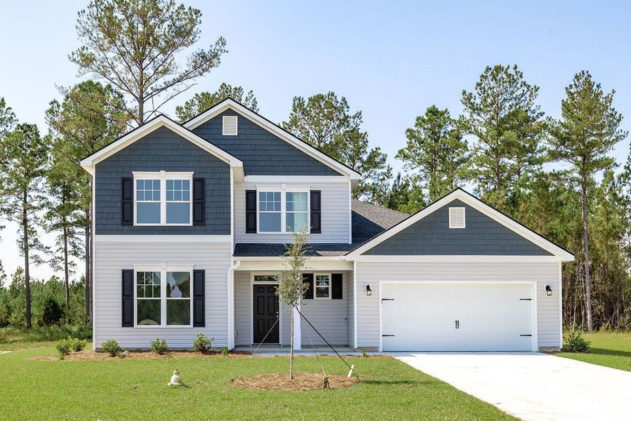 Front exterior of a new home in NorthShore on the St. Marys River, Kingsland, GA, highlighting curb appeal (Image 1). Front exterior of a new home in NorthShore on the St. Marys River, Kingsland, GA, highlighting curb appeal (Image 1).