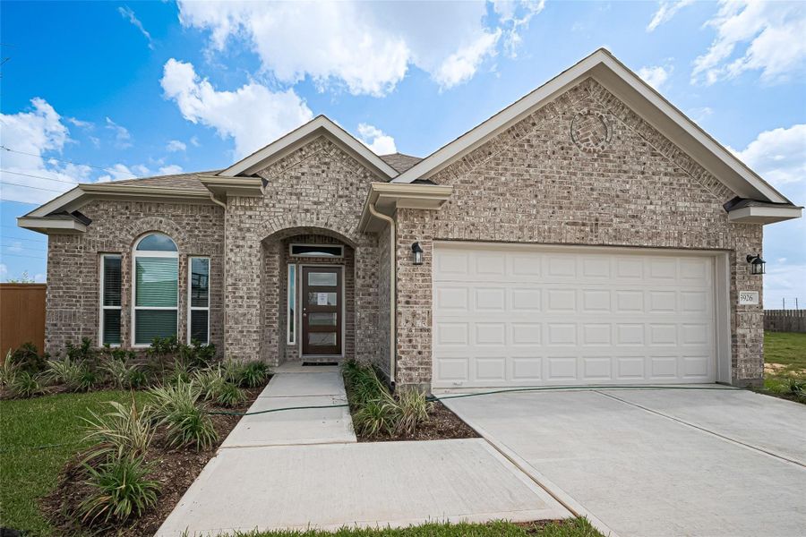 Front exterior of a new home in Rollingbrook Estates, Baytown, TX, highlighting curb appeal (Image 2). Front exterior of a new home in Rollingbrook Estates, Baytown, TX, highlighting curb appeal (Image 2).