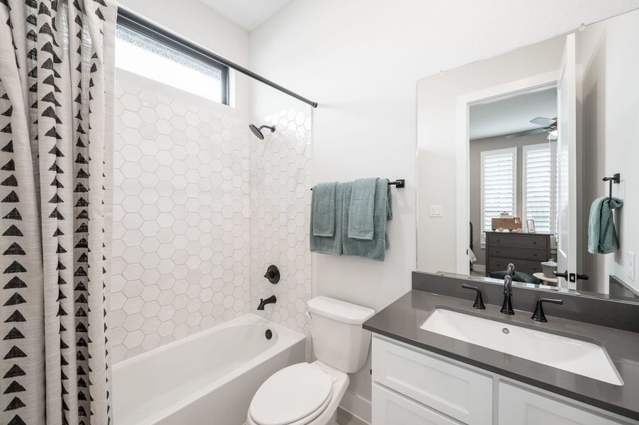Representative furnished interior of a home built from the Carignan by Tri Pointe Homes in Woodson’s Reserve, Spring (Image 66).