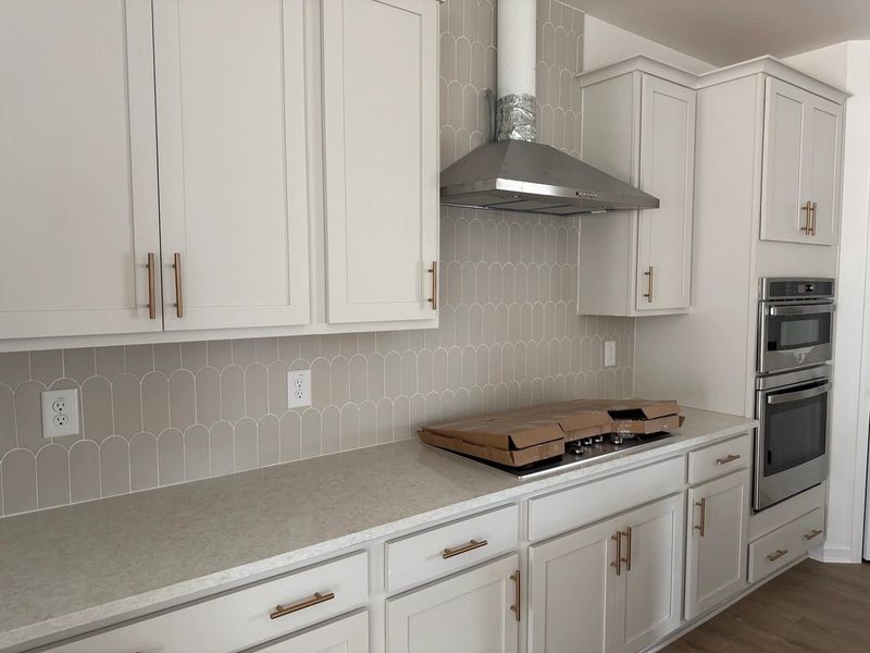 Kitchen featuring the AW Collection® Serene - Clean lines and earthy textures define the space. Kitchen featuring the AW Collection® Serene - Clean lines and earthy textures define the space.