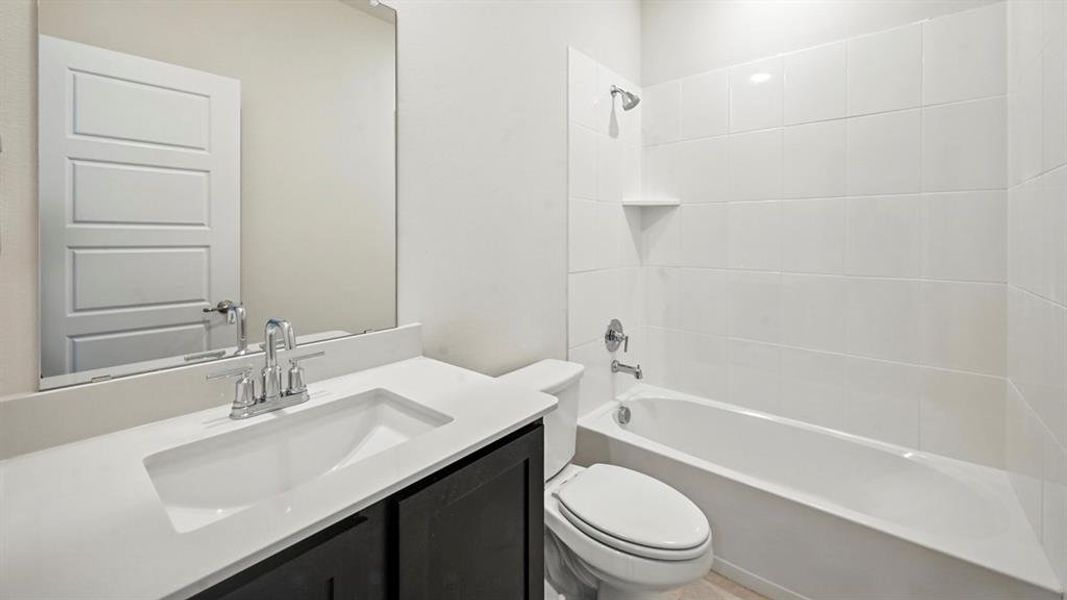 Full bath featuring vanity and tub / shower combination