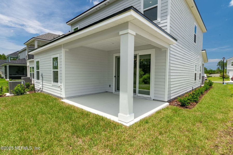 Front exterior of a new home in Beacon Lake, St. Augustine, FL, highlighting curb appeal (Image 27).