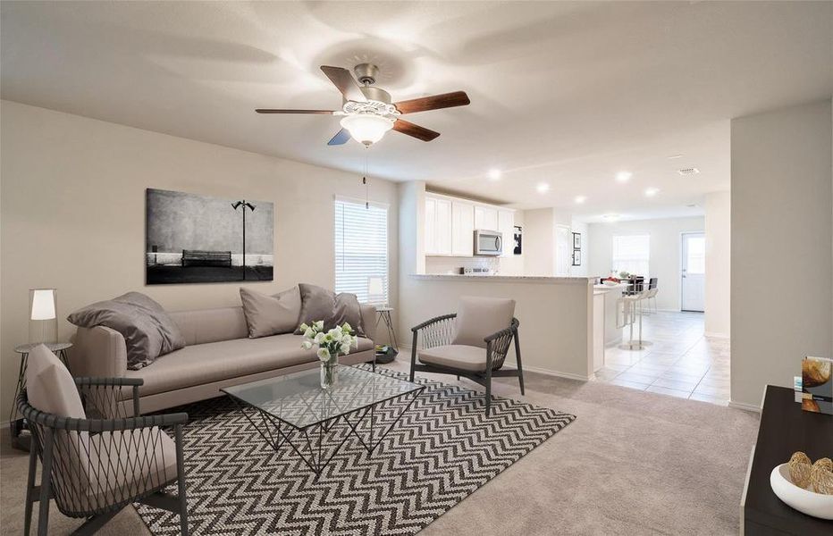 Living room with plenty of natural light, light carpet, a ceiling fan, recessed lighting, and light tile patterned flooring Living room with plenty of natural light, light carpet, a ceiling fan, recessed lighting, and light tile patterned flooring