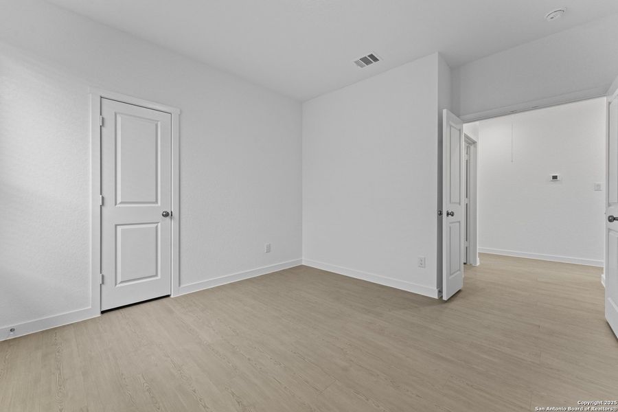 Spacious, unfurnished interior of a new home in Waterwheel: Coastline Collection, San Antonio (Image 17).