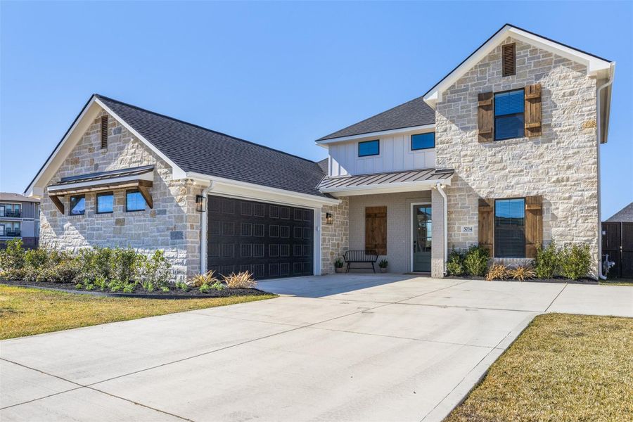 Front exterior of a new home in , Bryan, TX, highlighting curb appeal (Image 27).
