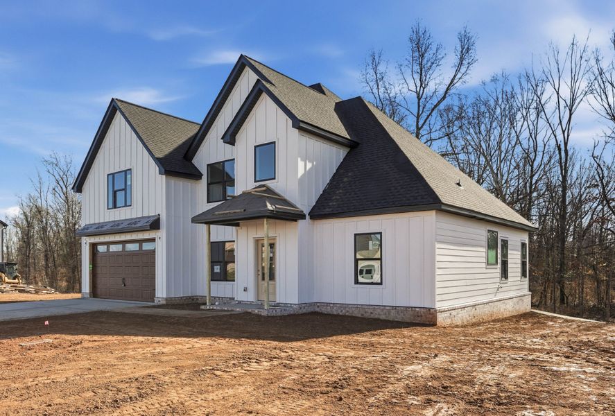 Front exterior of a new home in Bellshire, Clarksville, TN, highlighting curb appeal (Image 2). Front exterior of a new home in Bellshire, Clarksville, TN, highlighting curb appeal (Image 2).