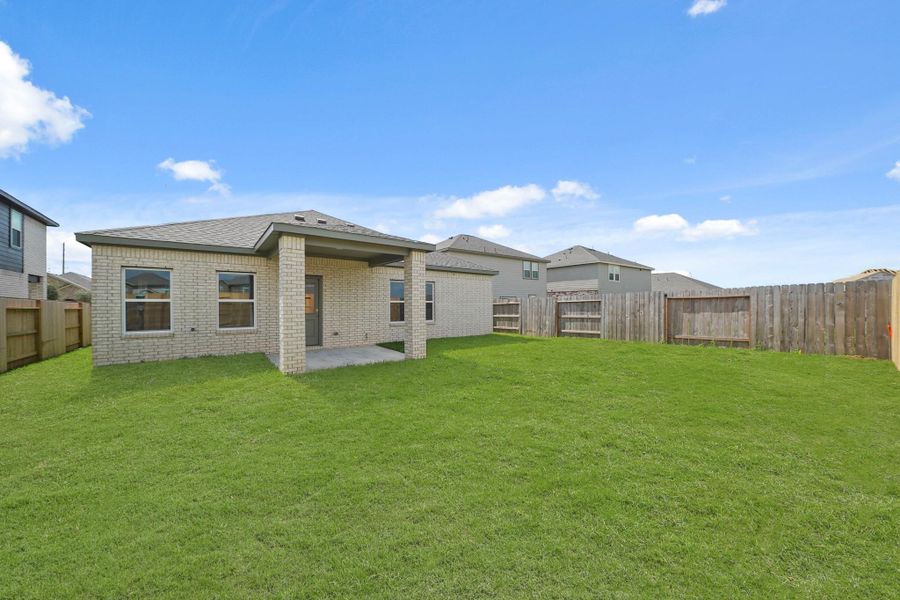 Front exterior of a new home in Sunterra, Katy, TX, highlighting curb appeal (Image 2). Front exterior of a new home in Sunterra, Katy, TX, highlighting curb appeal (Image 2).
