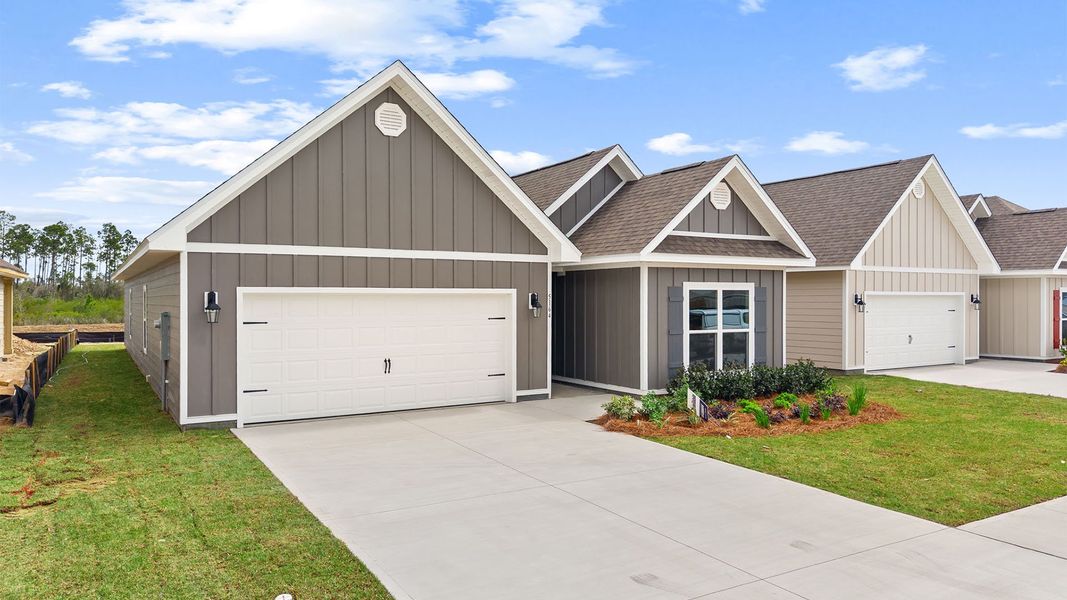 Front exterior of a new home in Titus Park, Panama City, FL, highlighting curb appeal (Image 2). Front exterior of a new home in Titus Park, Panama City, FL, highlighting curb appeal (Image 2).