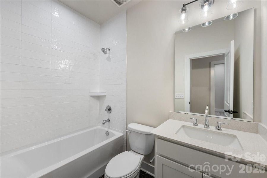 Secondary Bathroom with Upgraded Tile Surround Shower.