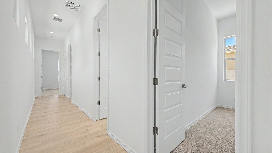Furnished interior view inside a new home in Windrose, Waddell (Image 29).