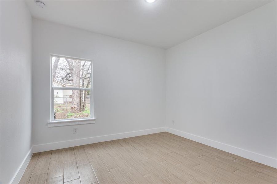 Spare room featuring light hardwood / wood-style flooring