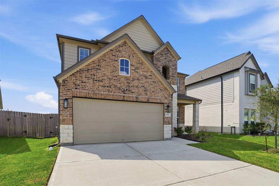 Front exterior of a new home in Sheldon Ridge, Houston, TX, highlighting curb appeal (Image 21).
