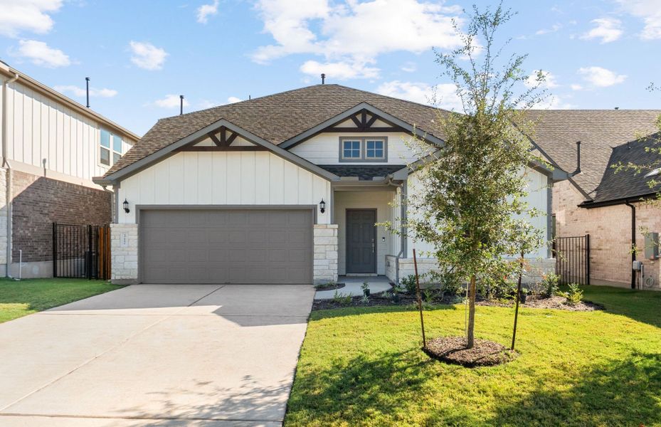Front exterior of a new home in Saddleback at Santa Rita Ranch, Liberty Hill, TX, highlighting curb appeal (Image 28). Front exterior of a new home in Saddleback at Santa Rita Ranch, Liberty Hill, TX, highlighting curb appeal (Image 28).