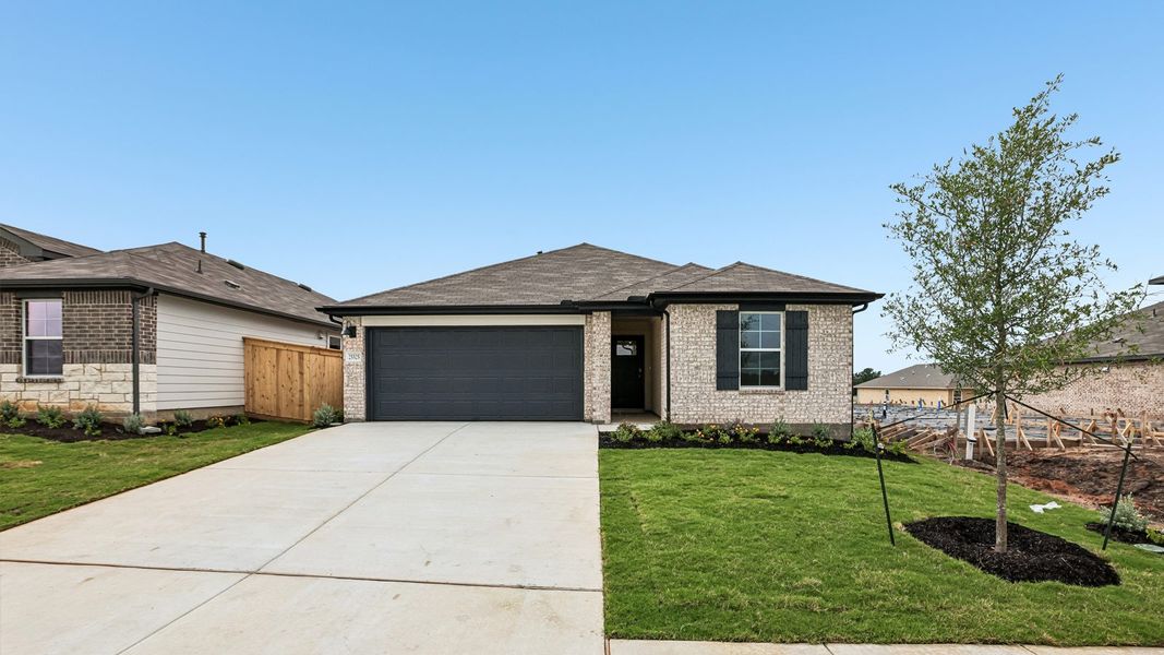 Front exterior of a new home in Briarwood, Elgin, TX, highlighting curb appeal (Image 2).