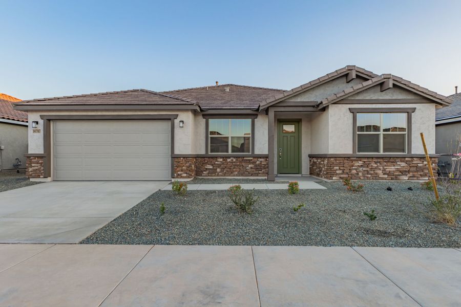 Front exterior of a new home in Miravida, Surprise, AZ, highlighting curb appeal (Image 1). Front exterior of a new home in Miravida, Surprise, AZ, highlighting curb appeal (Image 1).