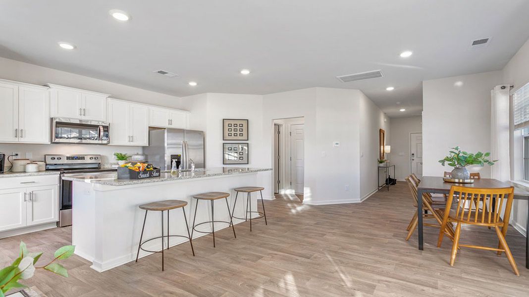 Representative furnished interior of a home built from the Maywood by D.R. Horton in The Gables at Edinborough Townes, Gibsonville (Image 10).