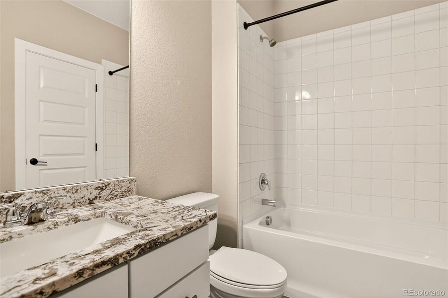 Ensuite bath for bed 4 with soaking tub and granite topped vanity Ensuite bath for bed 4 with soaking tub and granite topped vanity