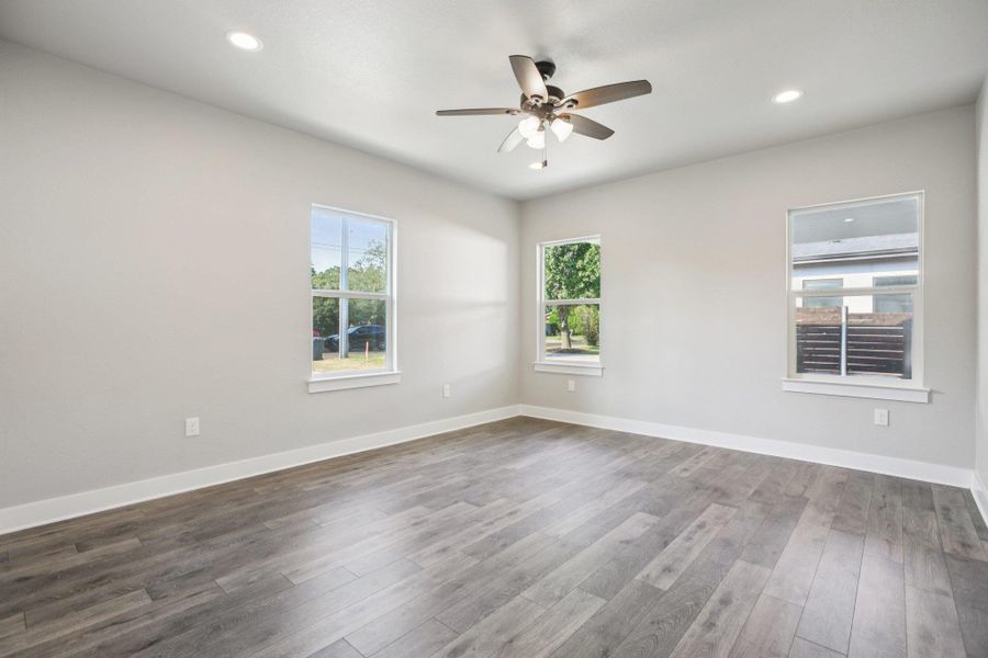 Spare room featuring recessed lighting, light wood-style floors, and a ceiling fan